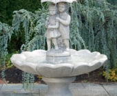 SINGLE TIER LARGE GIRL AND BOY UNDER UMBRELLA FOUNTAIN